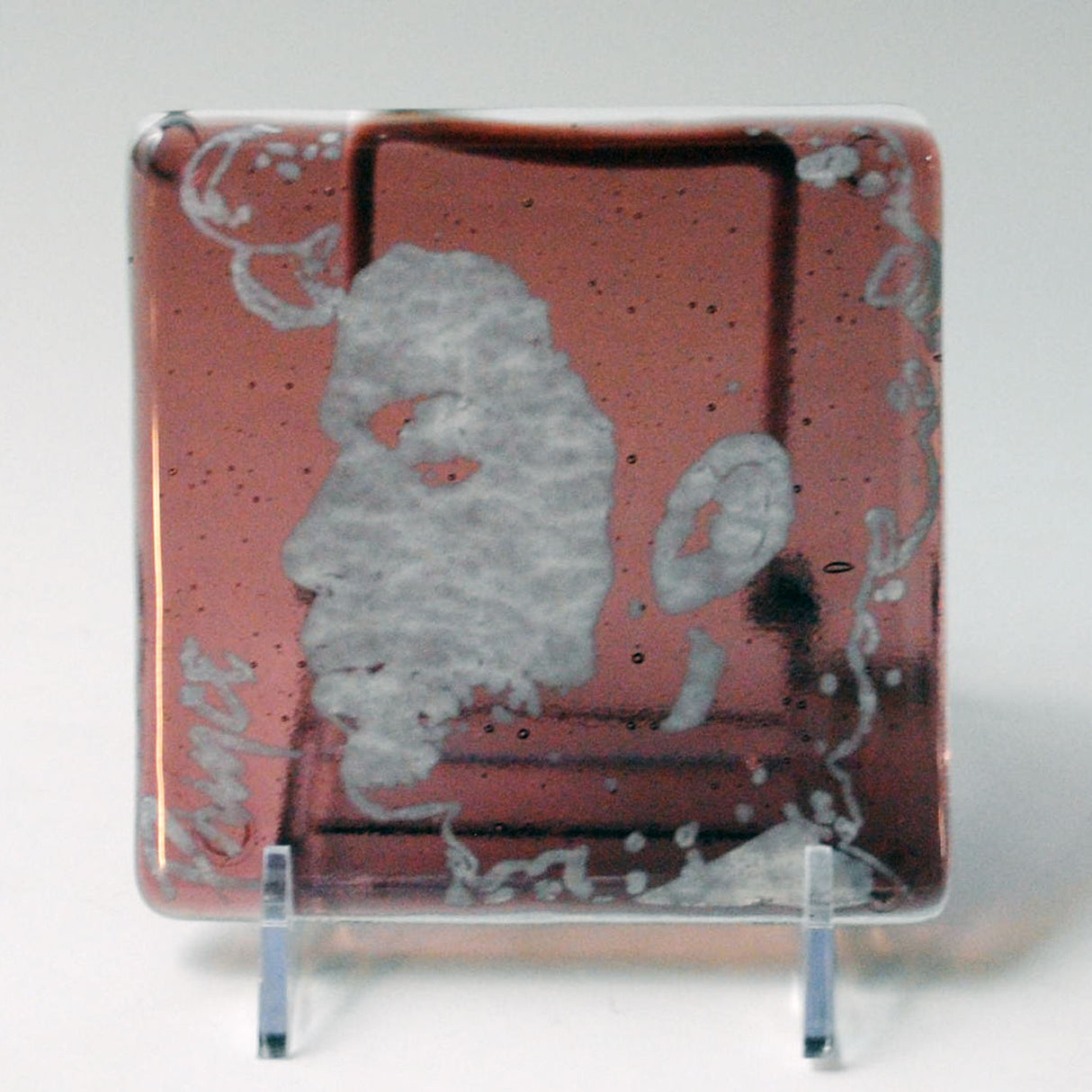 a glass plate with a picture of a man on it