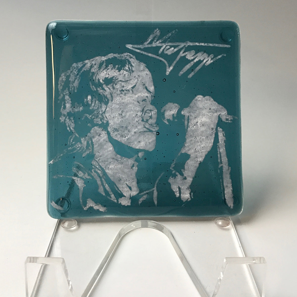 a glass plaque with a picture of a man on it