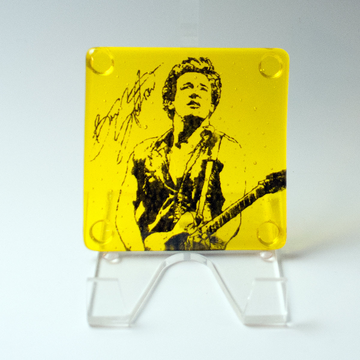 a yellow and black picture of a woman with a guitar