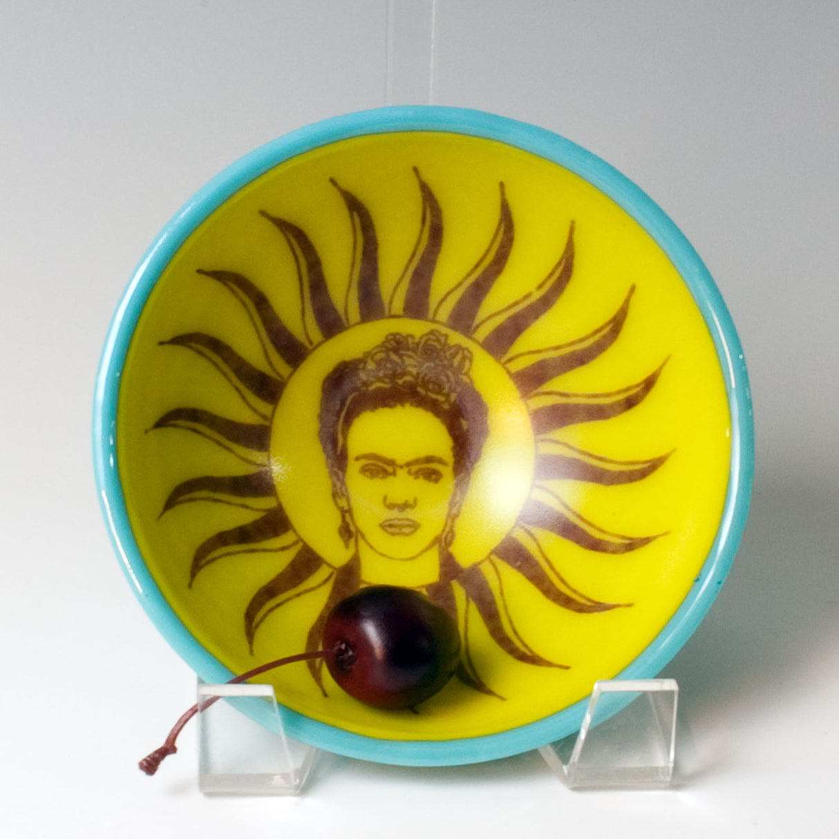 a yellow and blue plate with a picture of a man on it