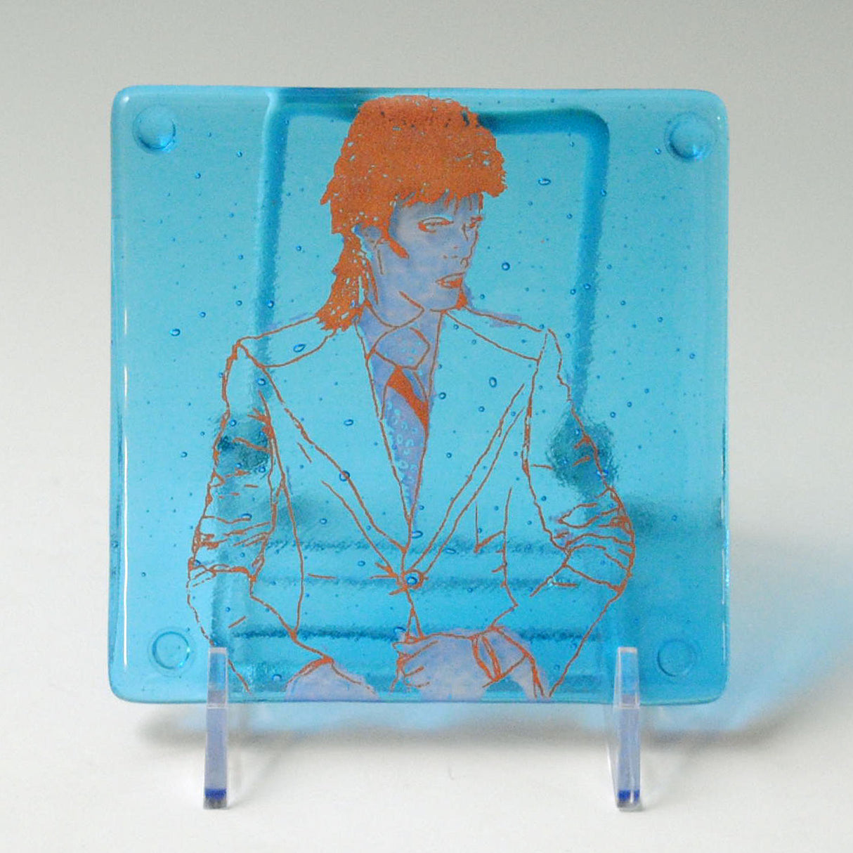 a glass picture of a man in a suit