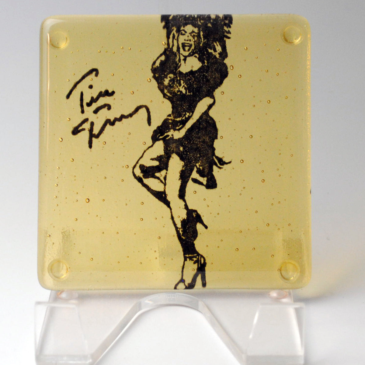a glass plaque with a drawing of a woman on it