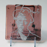 a piece of glass with a picture of a man on it