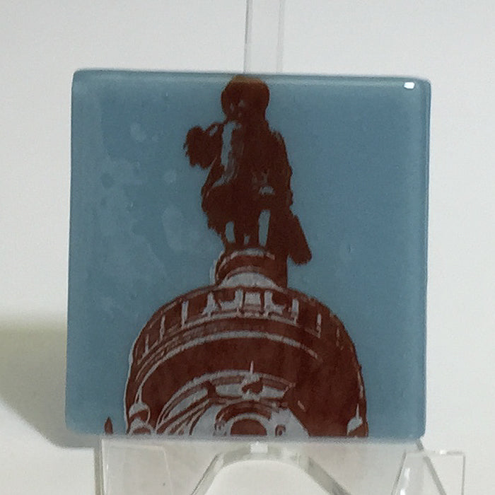 a picture of a statue on top of a building